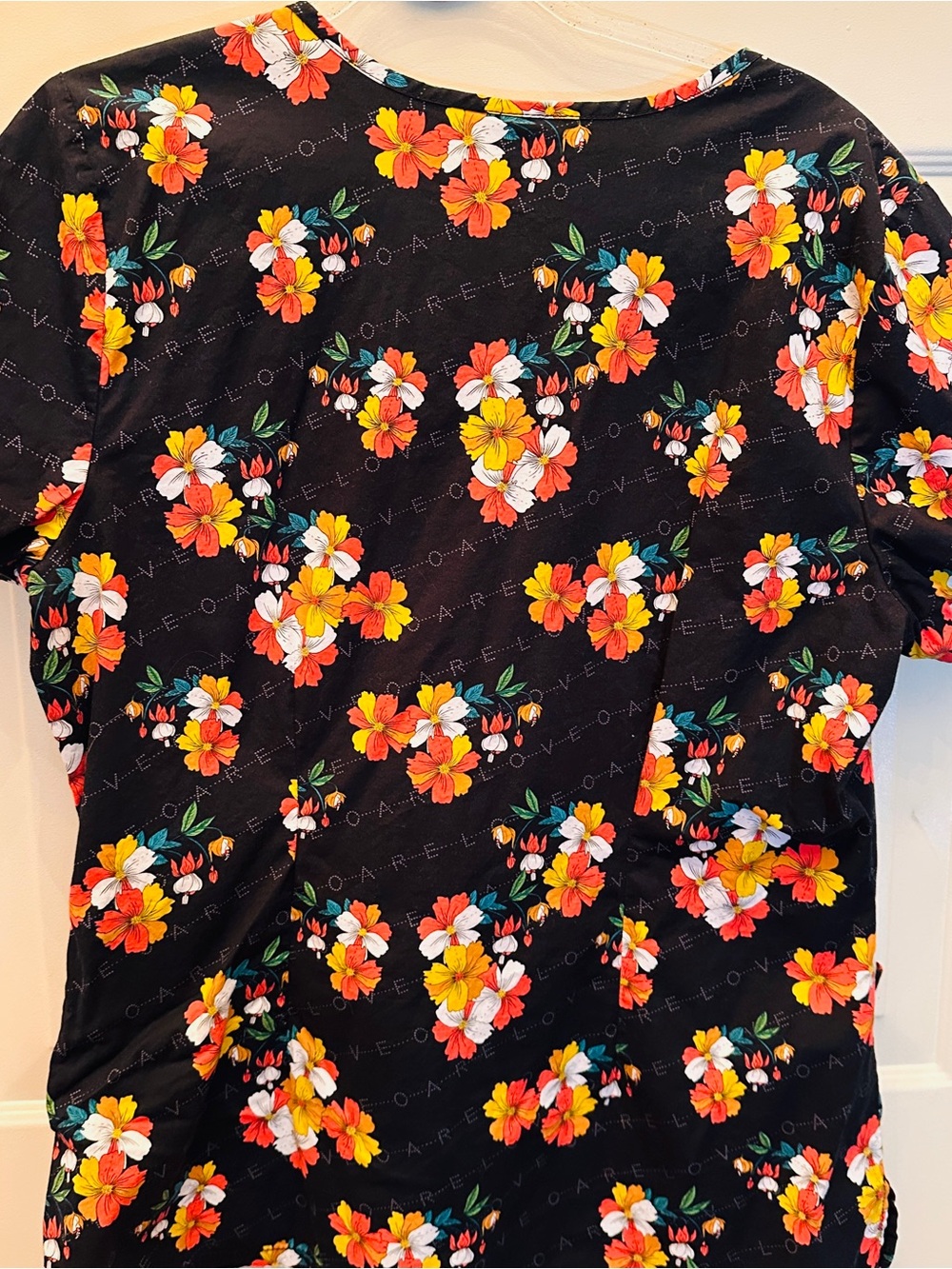 Black Floral scrub top with Bright Orange & Yellow Blossoms
